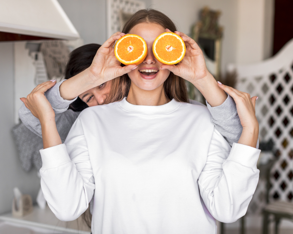young-women-playing-with-oranges.jpg