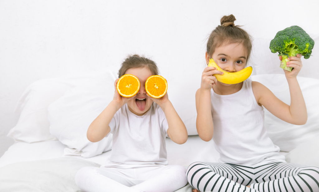 happy-two-cute-children-playing-with-fruits-vegetables.jpg