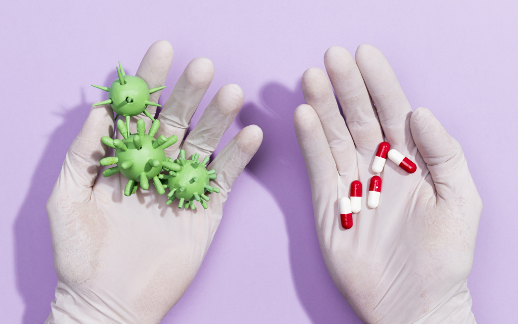 hands-with-pills-bacteria.jpg