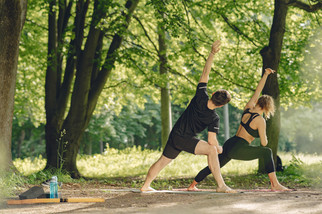young-sportive-couple-doing-yoga-fitness-people-summer-park.jpg