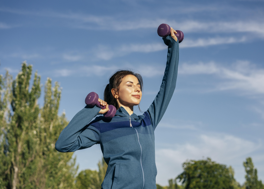 medium-shot-woman-practicing-with-dumbbells.jpg